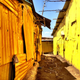 Image for article titled An artist has painted mosques and churches across Kenya yellow to promote peace